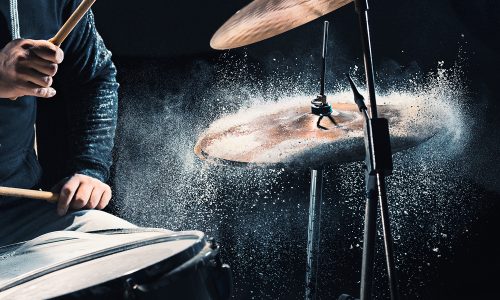 Why Do Drummers Wear Headphones When They Play Live Concerts?